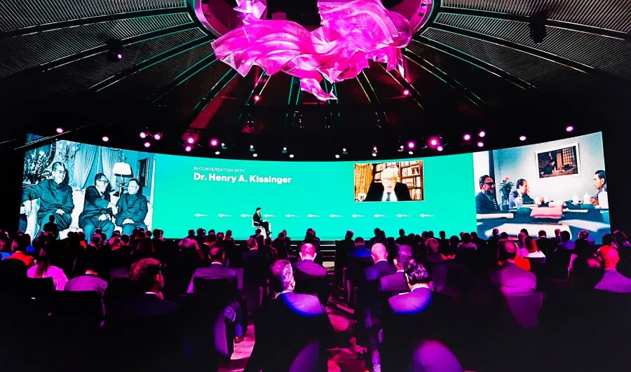 Former US secretary of State Henry Kissinger (inset on screen) at a Bloomberg forum, 17 November 2021. (Bloomberg)