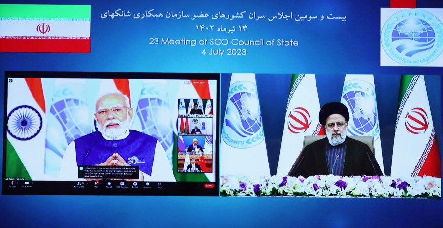 Iranian President Ebrahim Raisi, together with Indian Prime Minister Narendra Modi, attend the 23rd Shanghai Cooperation Organisation Council of Heads of State (SCO) Summit via video link, at the Office of the President of Iran, in Tehran, Iran, 4 July 2023. (Iran's Presidency/WANA (West Asia News Agency)/Handout via Reuters)