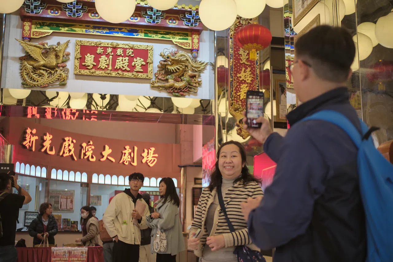 Visitors take photos to capture the last moments of the Sunbeam Theatre. (CNS)
