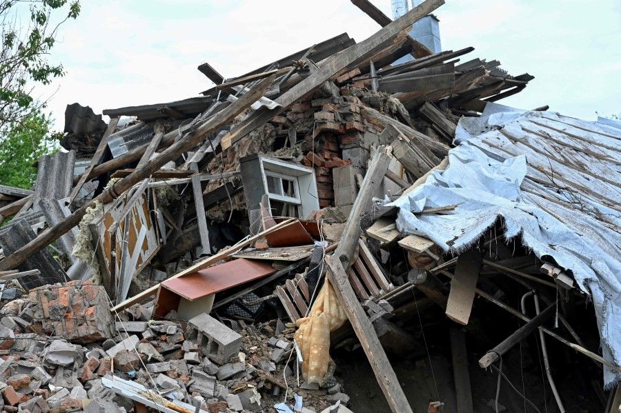 This photograph taken on 22 May 2023 shows a destroyed residential house following a strike in the village of Tsirkuny, Kharkiv region, amid the Russian invasion of Ukraine. (Sergey Bobok/AFP)