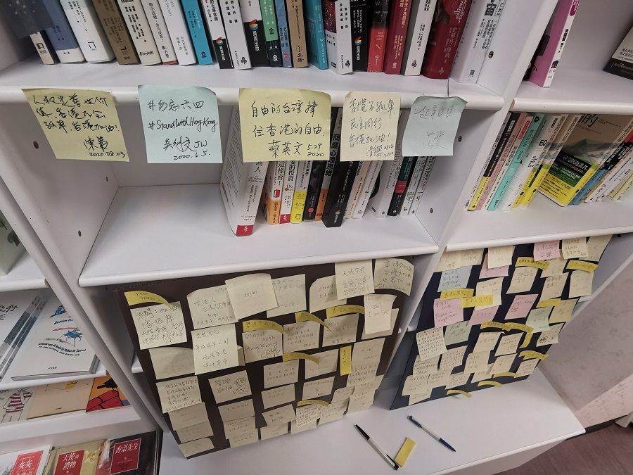 The "Lennon Wall" in Lam's bookstore. Taiwan President Tsai Ing-wen's note is seen at the top, third from left.