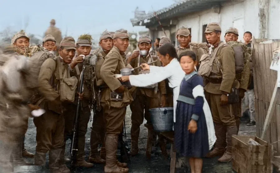 Korean women serving tea to Japanese imperial soldiers, 1930s.
