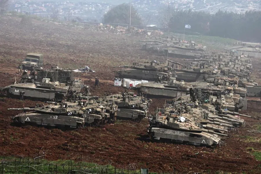 Israeli tanks gather at a position along the Israel-Lebanon border on 8 March 2026. (Jack Guez/AFP)