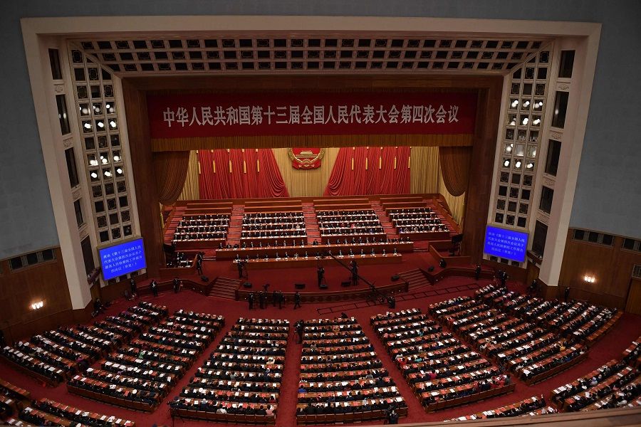 This file photo taken on 11 March 2021 shows Chinese leaders attending the closing session of the National People's Congress at the Great Hall of the People in Beijing, China. (Nicolas Asfouri/AFP)