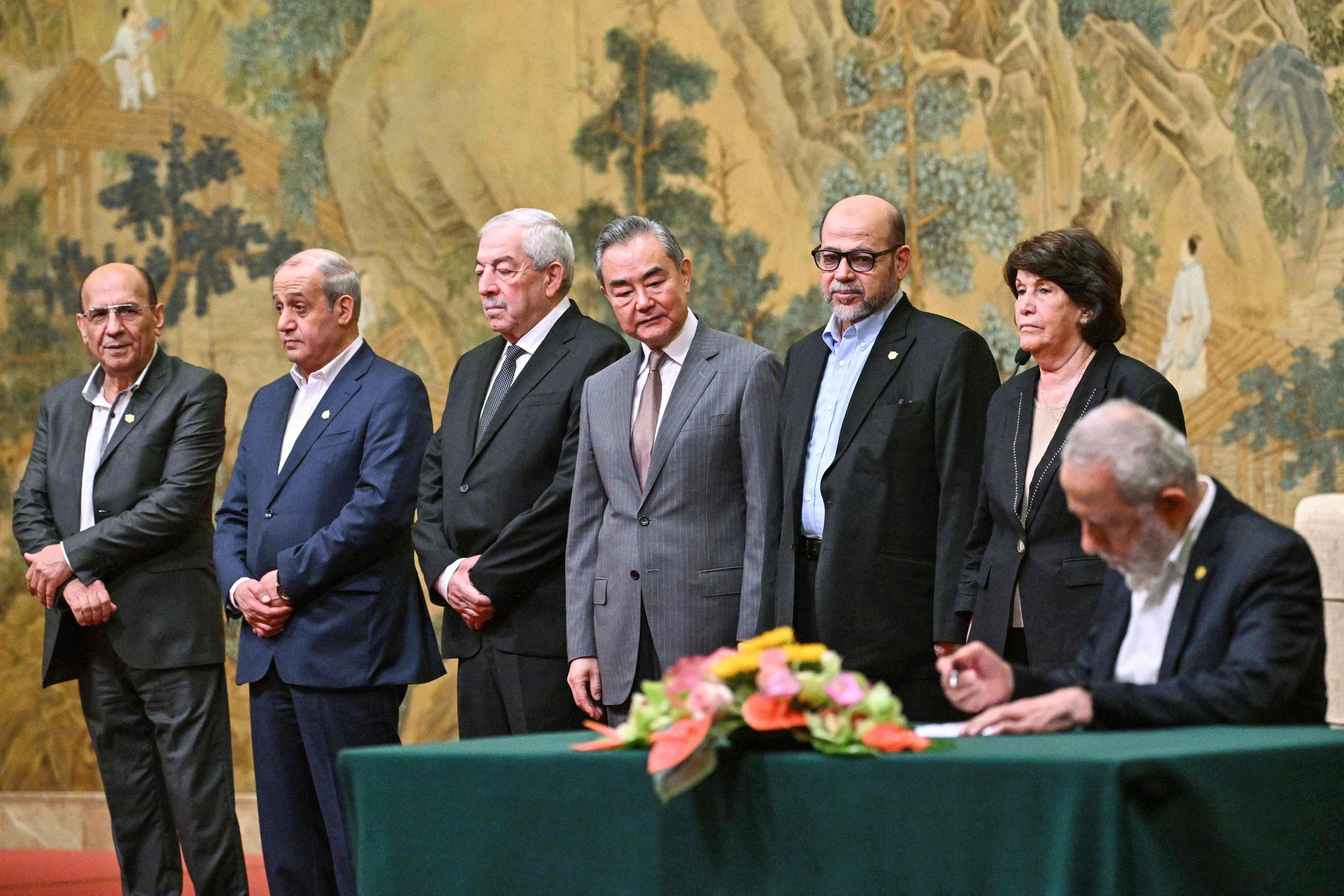 China’s Foreign Minister Wang Yi (centre) looks on during the signing of the “Beijing declaration” at the Diaoyutai State Guesthouse in Beijing on 23 July 2024. (Pedro Pardo/AFP)
