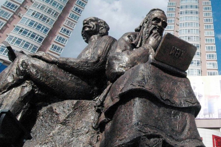 A sculpture of Confucius using a computer alongside Einstein, Harbin, 2004. Confucian thought is marked by innovativeness and an impetus to keep advancing with the times. (Xinhua)