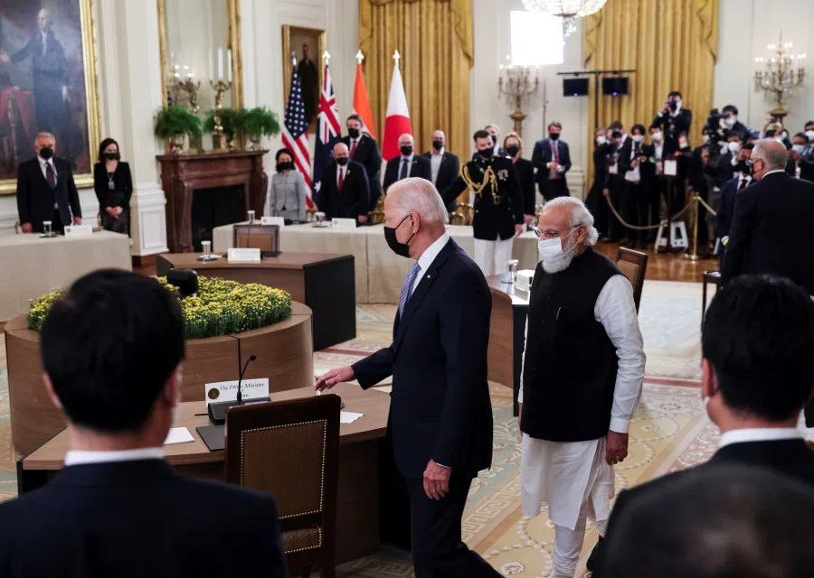 US President Joe Biden and India's Prime Minister Narendra Modi arrive for a 'Quad nations' meeting at the Leaders' Summit of the Quadrilateral Framework held in the East Room at the White House in Washington, US, 24 September 2021. (Evelyn Hockstein/Reuters)