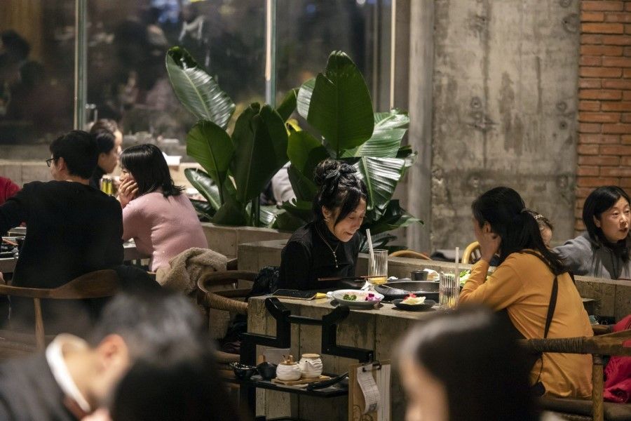 Customers at a hotpot restaurant in Chengdu, China, on 13 January 2023. (Qilai Shen/Bloomberg)