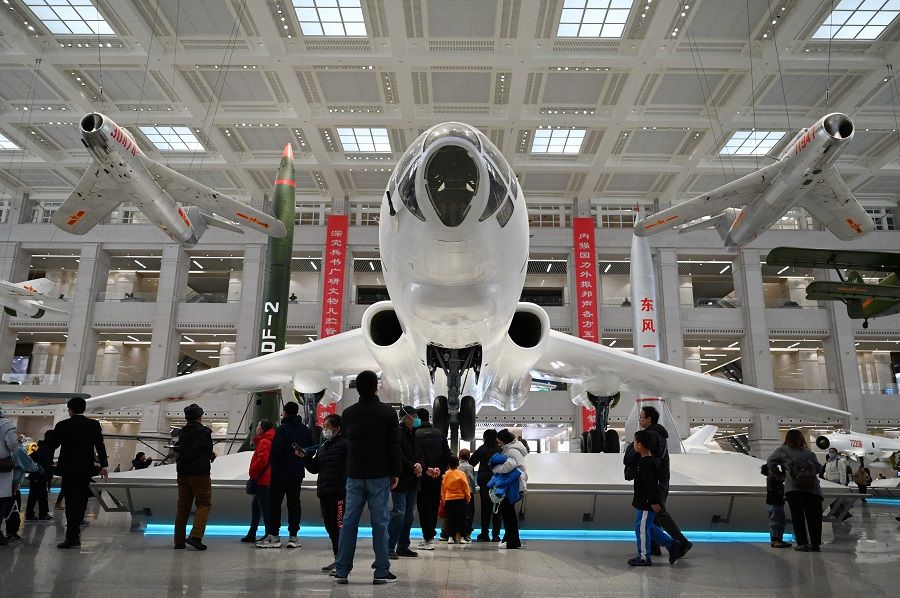 People look at a Chinese H6 bomber and other aircraft at the Military Museum in Beijing, China, on 3 March 2024. (Greg Baker/AFP)