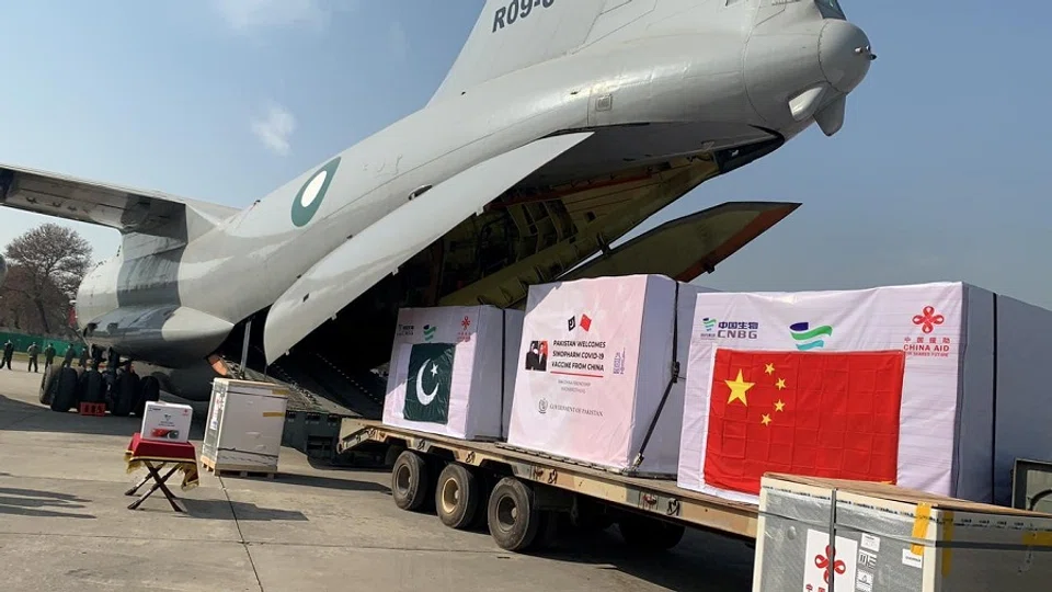 A general view of the first consignment of the Covid-19 vaccines from China, seen offloading from a plane at the PAF Base Nur Khan, Pakistan in this handout photo released by Inter-Services Public Relations (ISPR) on 1 February 2021. (Inter-Services Public Relations (ISPR)/Handout via Reuters)