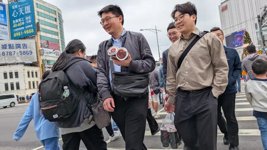 People cross a street in Taipei, Taiwan, on 13 December 2024. (Candice Chan/SPH Media)