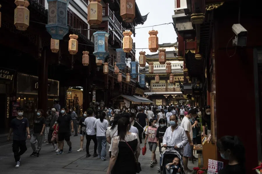 Visitors walk through the Yuyuan Garden in Shanghai, China, on 2 October 2022. (Qilai Shen/Bloomberg)