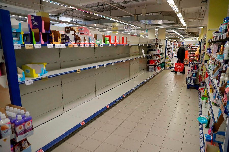 An empty shelf is pictured in a supermarket where toilet paper is sold out in Frankfurt (Oder), Germany, where people panic buy in a reaction to the spread of Covid-19. (Odd Andersen/AFP)