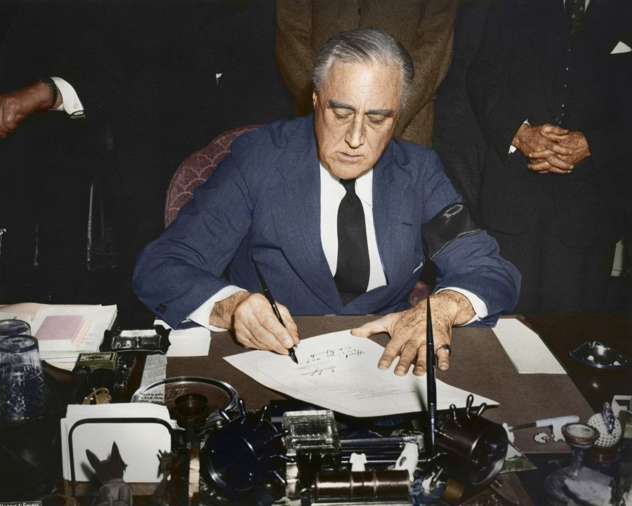8 December 1941, Capitol Hill - One day after Japan's raid on the U.S. Pacific Fleet at Pearl Harbor, President Franklin Roosevelt condemned the Japanese aggression in a speech to Congress, calling it a day to "live in infamy". He asked Congress to authorise a declaration of war against Japan. At 4.10 pm, the president signed the declaration of war against Japan while wearing a black ribbon on his left arm in memory of those killed in the Pearl Harbor attack.