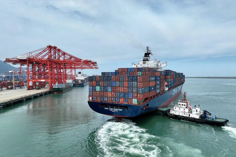 This photo shows a cargo ship loaded with containers leaving Lianyungang port in Jiangsu province, China, on 16 July 2023. (AFP)