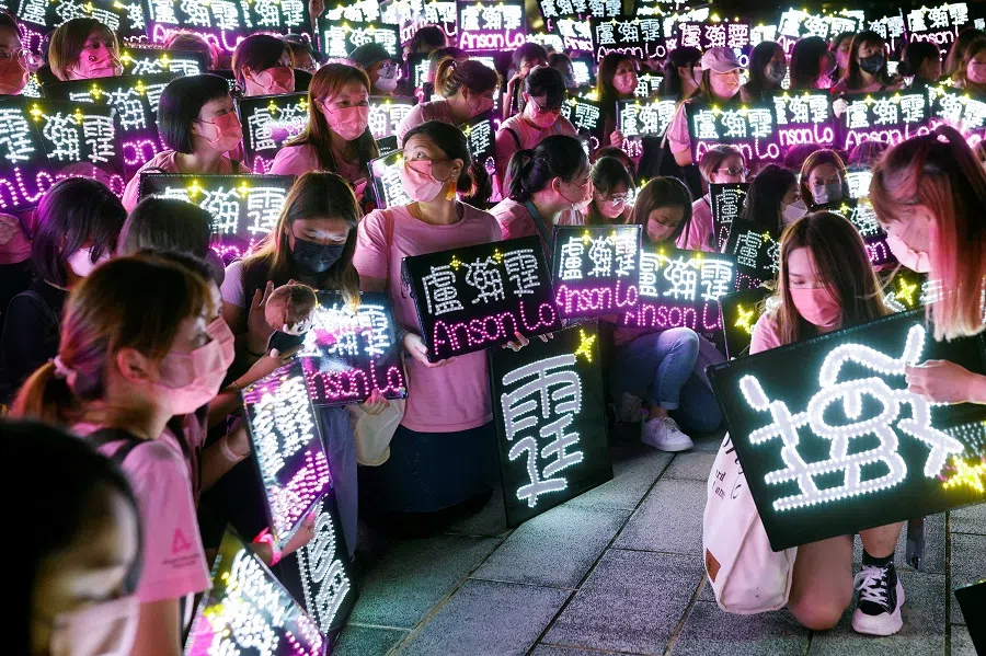 Fans of Anson Lo, a member of Hong Kong Cantopop boy band Mirror, pose for a group photo before the concert in Hong Kong, China, 25 July 2022. (Tyrone SiuReuters)