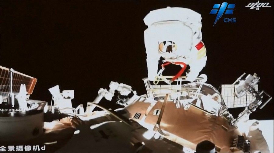 This screen grab made from video released by Chinese state broadcaster CCTV shows Chinese astronaut Wang Yaping stepping outside China's Tiangong space station in orbit around Earth on 7 November 2021. (Handout/CCTV/AFP)