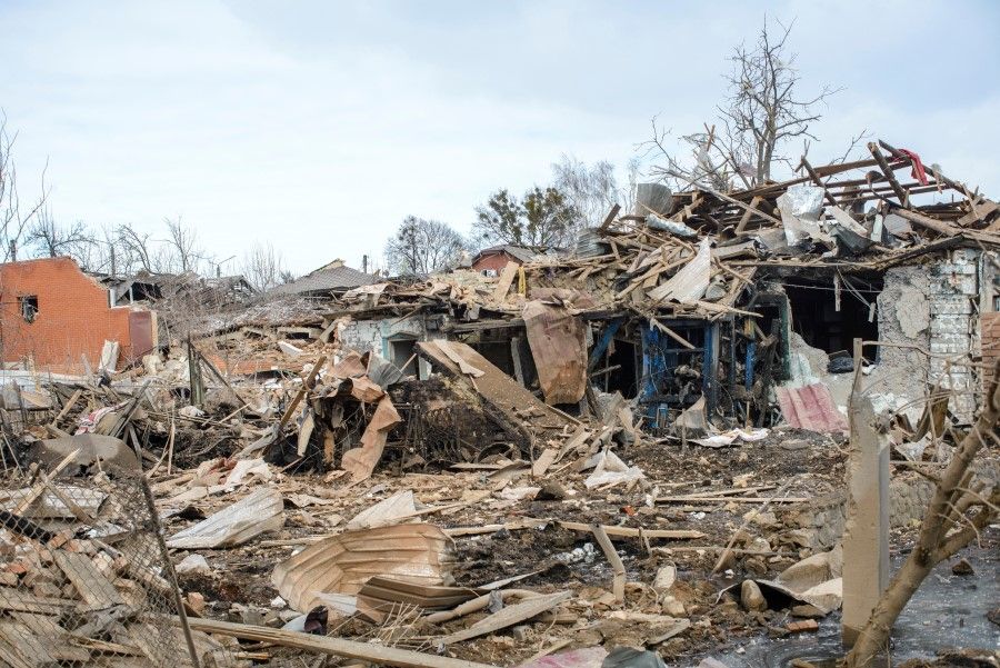 Debris and houses destroyed by shelling, amid Russia's invasion of Ukraine, are seen in Sumy, Ukraine, 8 March 2022 in this picture obtained from social media. (Andrey Mozgovoy via Reuters)