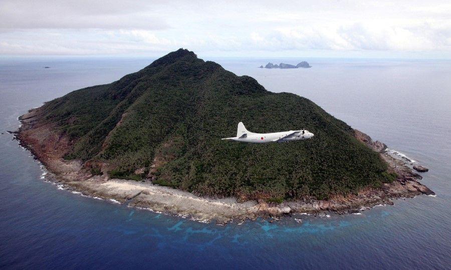 This file photo taken on 13 October 2011 shows a P-3C patrol plane of Japanese Maritime Self-Defense Force flying over the disputed islets known as the Senkaku islands in Japan and Diaoyu islands in China, in the East China Sea. A local assembly of Japan's southern Okinawa island on June 22, 2020 approved a plan to rename the area covering disputed islands in the East China Sea, sparking protests from Beijing and Taipei. (STR/AFP)
