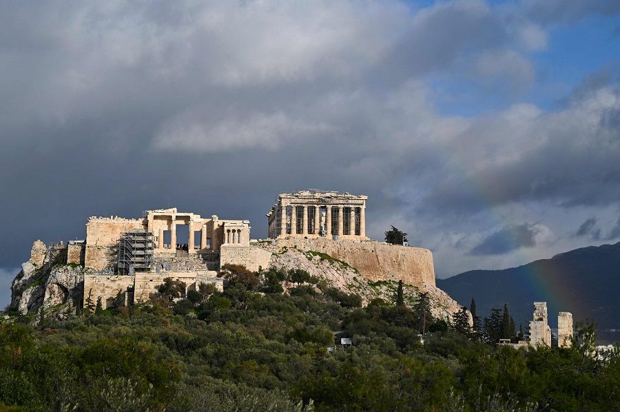 This photograph taken in Athens, Greece, on 8 February 2022 shows a rainbow appearing over the Ancient Acropolis. (Louisa Gouliamaki/AFP)
