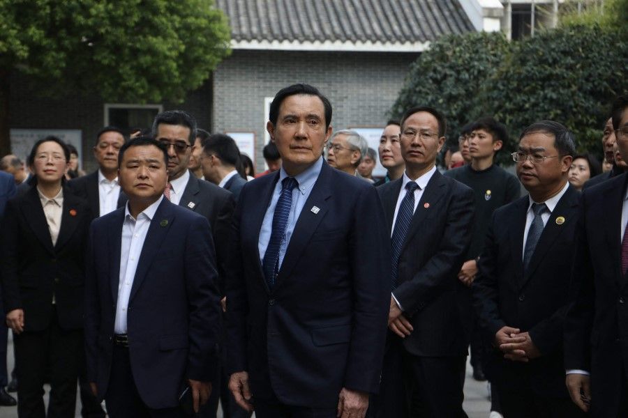 This handout picture taken and released by Taiwan's former president Ma Ying-jeou's office on 31 March 2023 shows former Taiwan President Ma Ying-jeou (centre) visiting his mother's school, the Zhounan High School, in Changsha in Hunan Province, China. (Handout/Ma Ying-jeou's office/AFP)