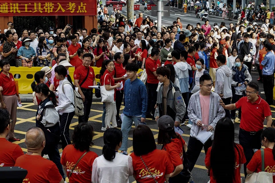 Students enter a school on the first day of the national college entrance examination, known as “gaokao”, in Wuhan, in central China’s Hubei province, on 7 June 2024. (AFP)