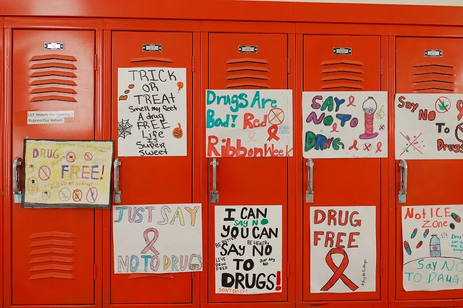 Student drawn signs hang on the lockers inside the Alamo Navajo Community School on the Alamo Navajo reservation in Southern New Mexico, US, on 15 January 2025.