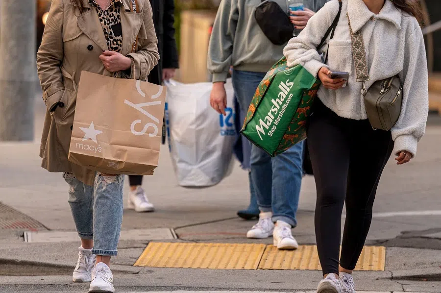 Shoppers carry shopping bags in San Francisco, California, US, on 13 November 2024. (David Paul Morris/Bloomberg)