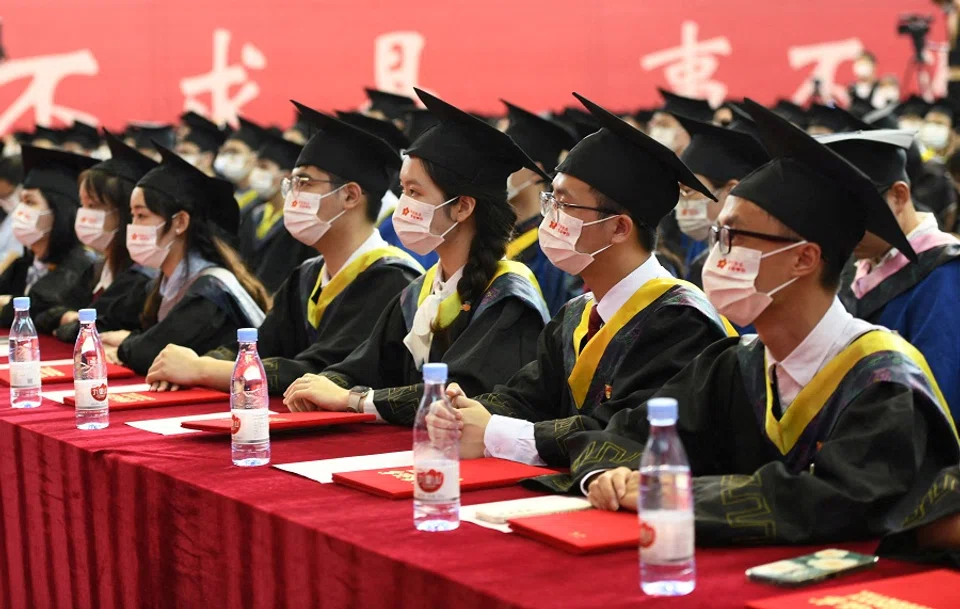 Graduating students wearing face masks attend a commencement ceremony at Chongqing University of Posts and Telecommunications in Chongqing, China, 22 June 2022. (CNS photo via Reuters)