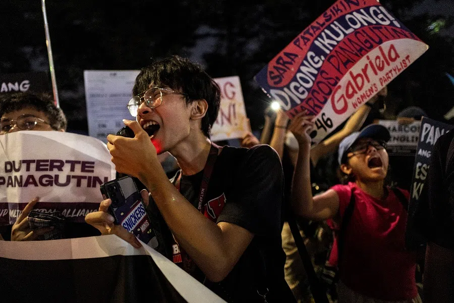 Filipino students shout “hustisya” (justice) as the names of victims of extrajudicial killings during former Philippine president Rodrigo Duterte’s administration are enumerated during a protest ahead of Duterte’s first International Criminal Court appearance, in Quezon City, Philippines, on 14 March 2025. (Eloisa Lopez/Reuters)