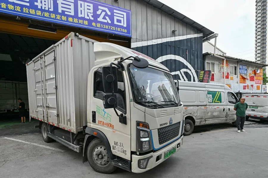 A truck carrying goods for delivery leaves a warehouse of the Weijiang International delivery company that works with packages of shopping giant Temu in Guangzhou in China's southern Guangdong province on 12 August 2025.  (Adek Berry/AFP)