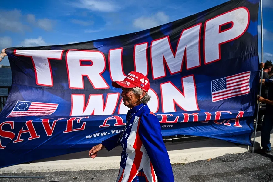 Supporters of Donald Trump celebrate his victory near his Mar-a-Lago resort in Palm Beach, Florida, on 6 November 2024. (Chandan Khanna/AFP)