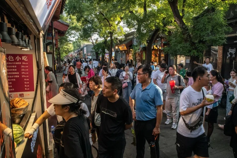 Visitors at Nanluoguxiang in Beijing, China, on 12 August 2023. (Bloomberg)