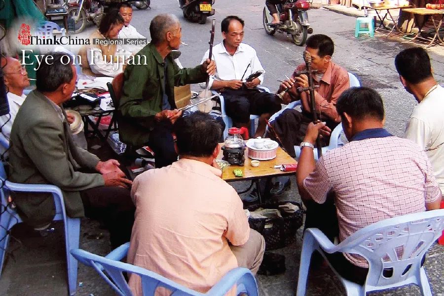 Elderly men drinking tea and playing the erhu on “Taiwan Street” in Zhangzhou, 2006.