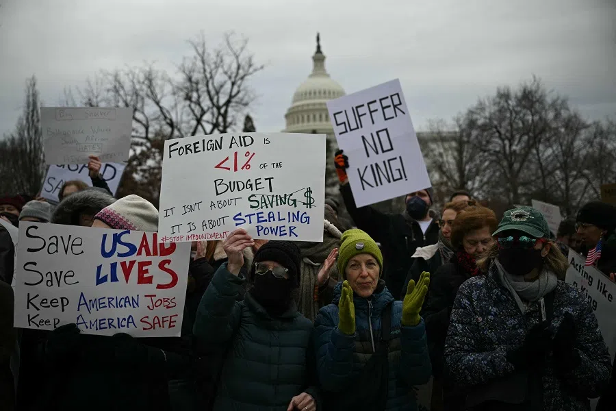 People protest against US President Donald Trump and Elon Musk’s plan to shutdown USAID outside the US Capitol on 5 February 2025. (Drew Angerer/AFP)