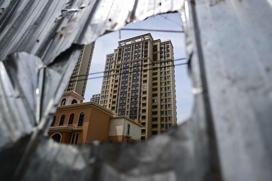 This photo taken on 20 June 2023 shows a view of a complex of unfinished apartment buildings in Xinzheng city in Zhengzhou, Henan province, China. (Pedro Pardo/AFP)