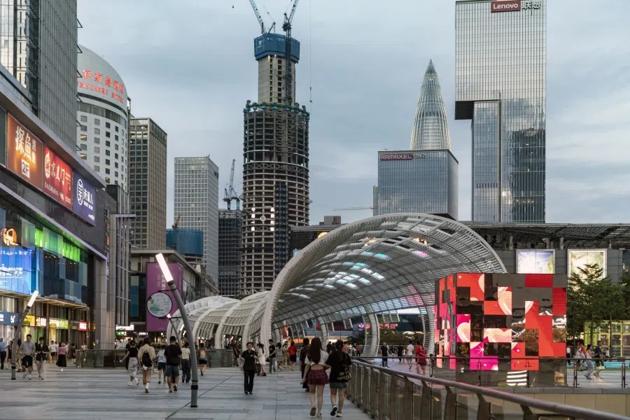 Pedestrians in Shenzhen, China, on 9 August 2023. (Qilai Shen/Bloomberg)
