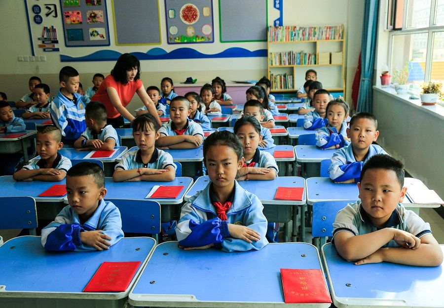 In this photo taken on 28 August 2023, students sit in a class at a primary school in Zhangye city, Gansu province, China. (AFP)