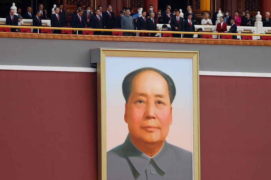 Chinese President Xi Jinping and other leaders stand above a giant portrait of late CCP chairman Mao Zedong as they arrive for the event marking the 100th founding anniversary of the CCP, on Tiananmen Square in Beijing, China, 1 July 2021. (Carlos Garcia Rawlins/File Photo/Reuters)