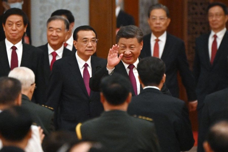 China's President Xi Jinping (C) and Premier Li Keqiang (3rd L) arrive for a reception at the Great Hall of the People on the eve of China's National Day in Beijing on 30 September 2022. (Noel Celis/AFP)