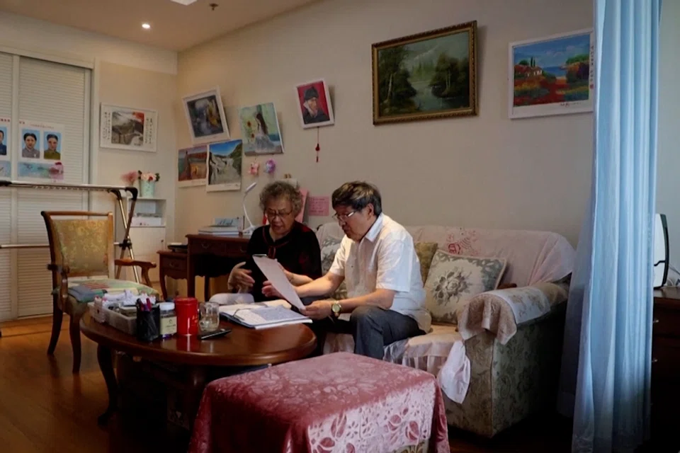 Elderly couple sings together in their room at Heyuejia retirement home in Beijing, China. (Screen grab from Reuters)