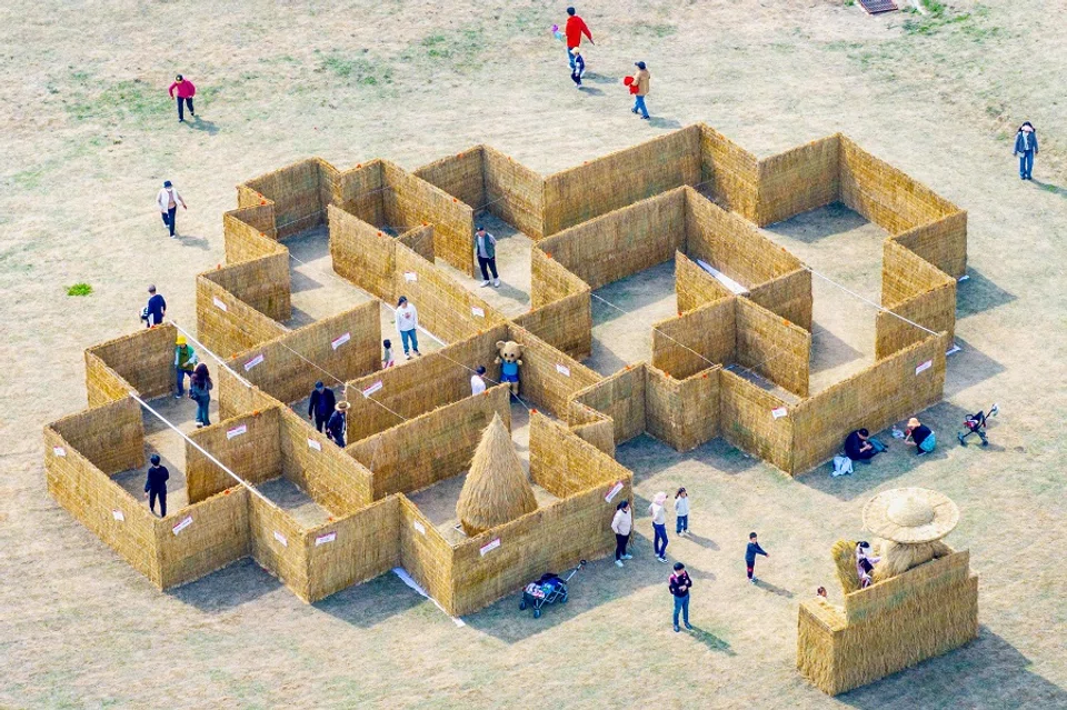 This aerial photograph taken on 5 April 2024 shows tourists at a vacation resort in Huai'an, in eastern China's Jiangsu province. (AFP)