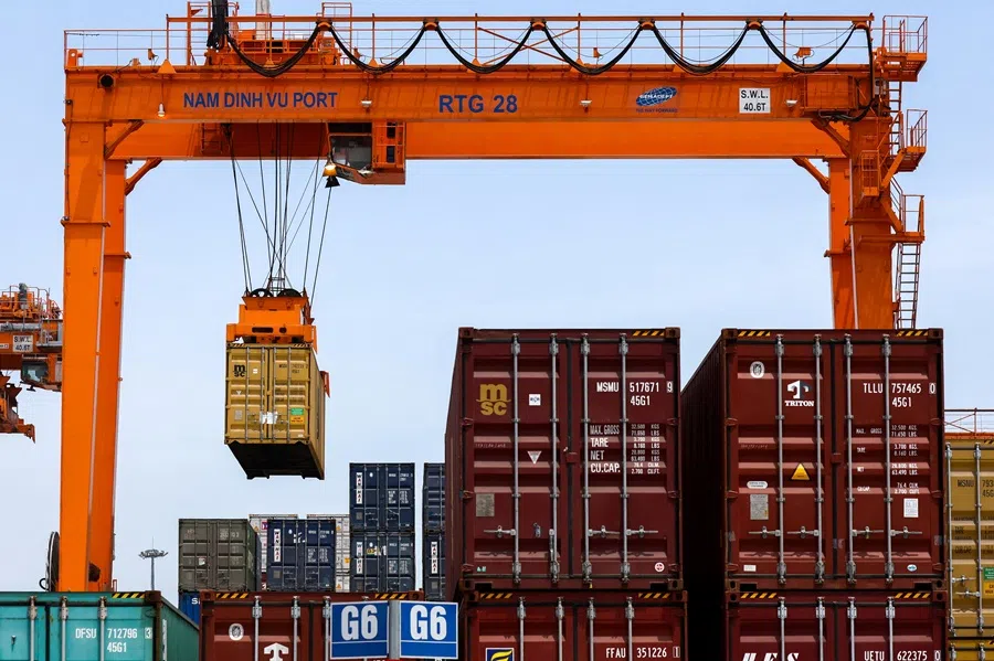 A container is loaded onto a cargo ship while docked at Hai Phong port in Hai Phong, Vietnam, on 16 April 2025.  (Athit Perawongmetha/Reuters)