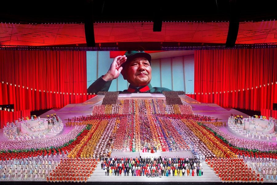 A screen shows late Chinese leader Deng Xiaoping during a show commemorating the 100th anniversary of the founding of the Communist Party of China at the National Stadium in Beijing, China, 28 June 2021. (Thomas Peter/File Photo/Reuters)