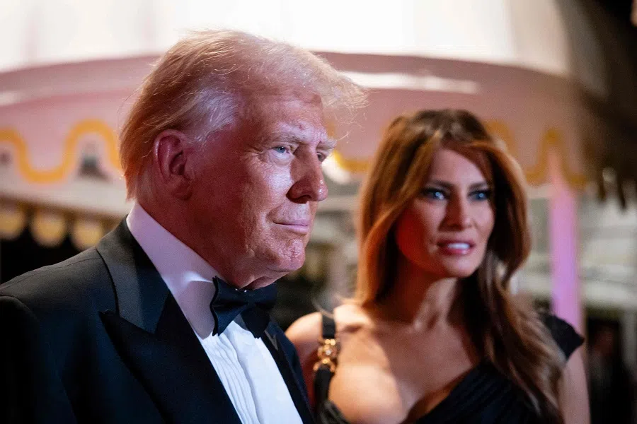 US President-elect Donald Trump and his wife Melania Trump arrive on New Year’s Eve at his Mar-A-Lago Club on 31 December 2024 in Palm Beach, Florida.