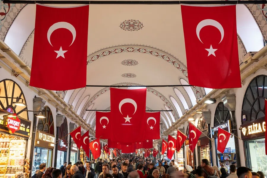 People stroll through the historic Grand Bazaar in Istanbul, Turkey, on 22 October 2024.