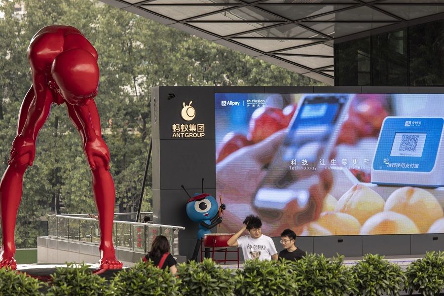A sculpture by artist Chen Wen Ling (left) and an Ant Group Co. mascot at the company's headquarters in Hangzhou, China, on 2 August 2021. (Qilai Shen/Bloomberg)