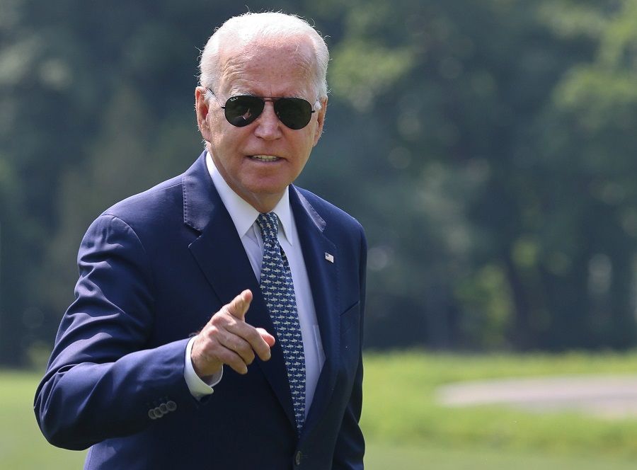 US President Joe Biden gestures towards members of the media as he arrives at the White House following a stay in Delaware, in Washington, US, 10 August 2021. (Evelyn Hockstein/Reuters)