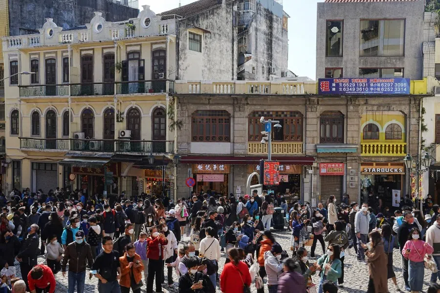 Visitors walk outside the ruins of Saint Paul's during Chinese New Year in Macau, China, 24 January 2023. (Lam Yik/Reuters)