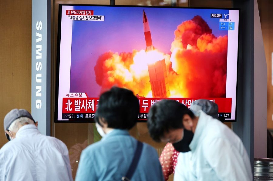 People watch a TV broadcasting file footage of a news report on North Korea firing what appeared to be a pair of ballistic missiles off its east coast, in Seoul, South Korea, 15 September 2021. (Kim Hong-Ji/File Photo/Reuters)